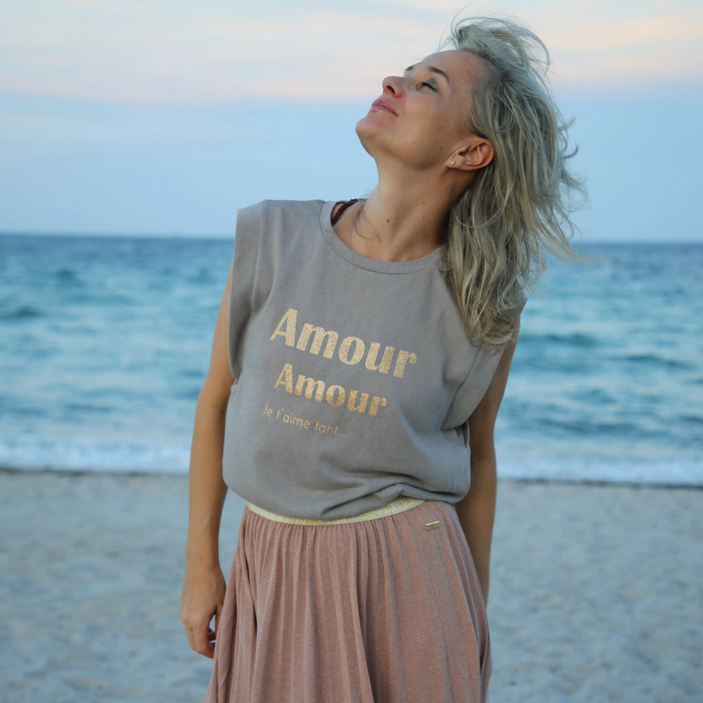 Woman wearing the 'Amour Amour' Top on a beach Spiritual Fashion by CocoMilkyWay