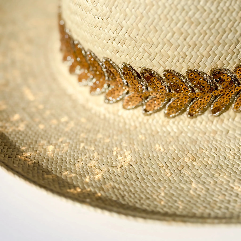 Close-up of a straw hat with glitter gold band Spiritual Fashion by CocoMilkyWay
