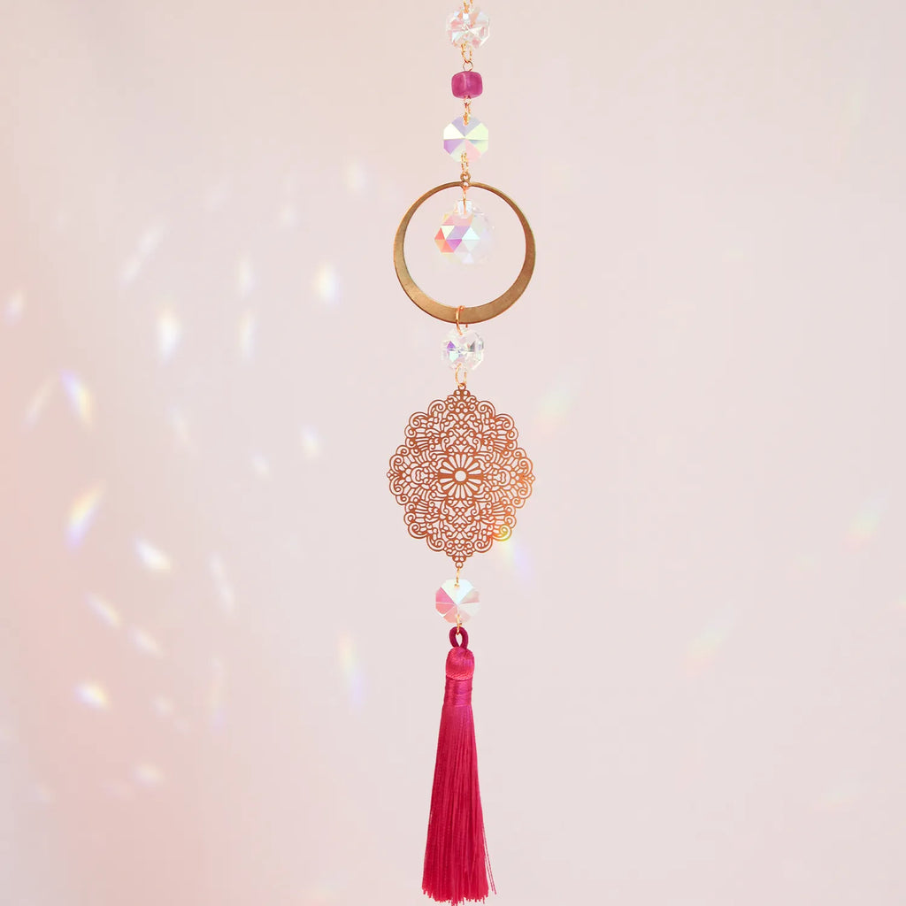 High Heart suncatcher with pink tassel by CocoMilkyWay, light-reflecting decor symbolizing love, compassion, and elevated energy