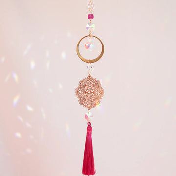 High Heart suncatcher with pink tassel by CocoMilkyWay, light-reflecting decor symbolizing love, compassion, and elevated energy